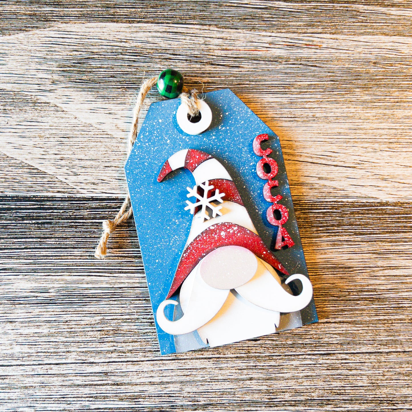 hand-painted Cocoa Gnome tag ornament with glitter and snowflake detail - Millie & Co.