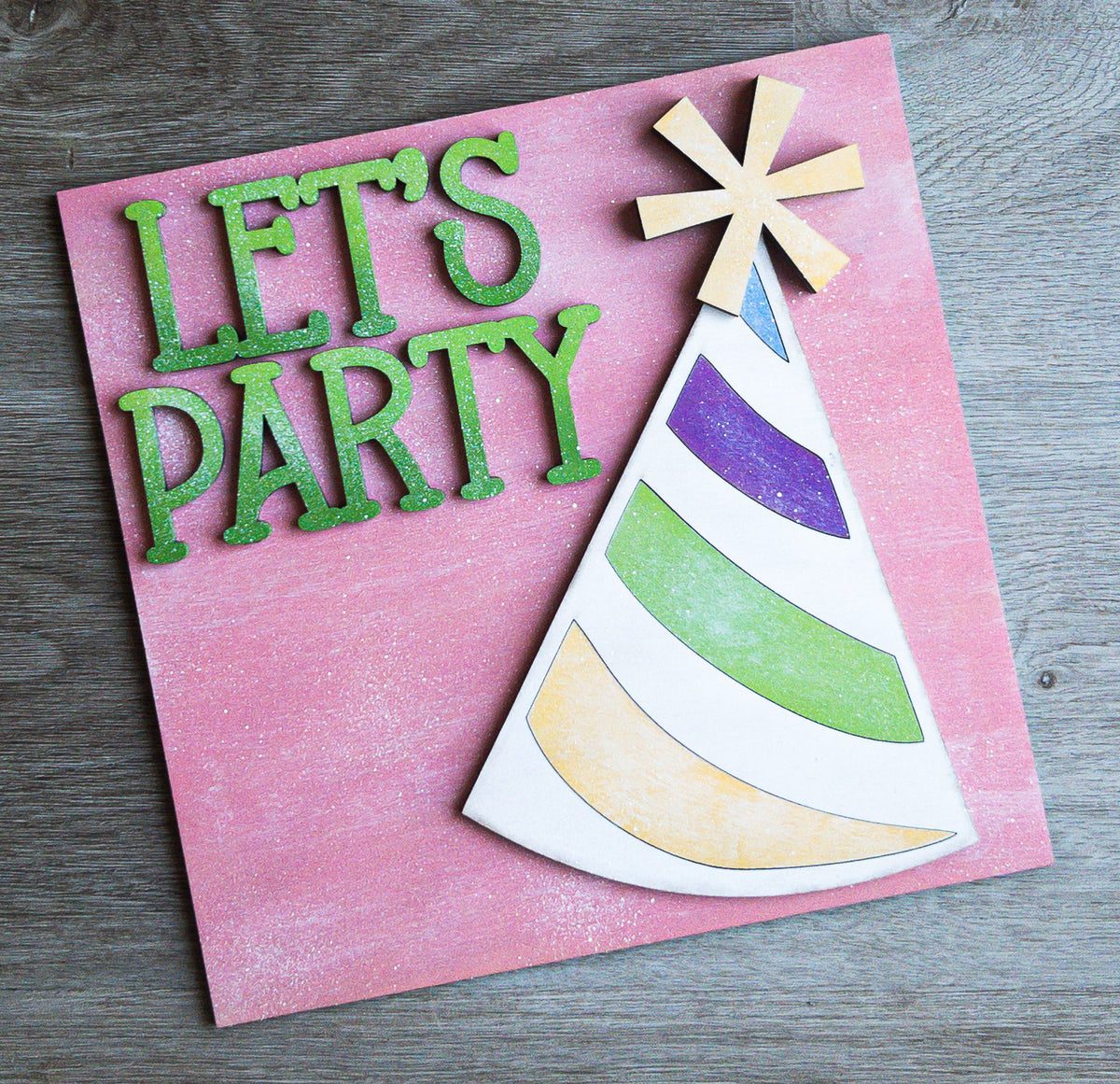 Interchangeable party porch decor tile with Let's Party lettering and a striped party hat on pink | Millie & Co.