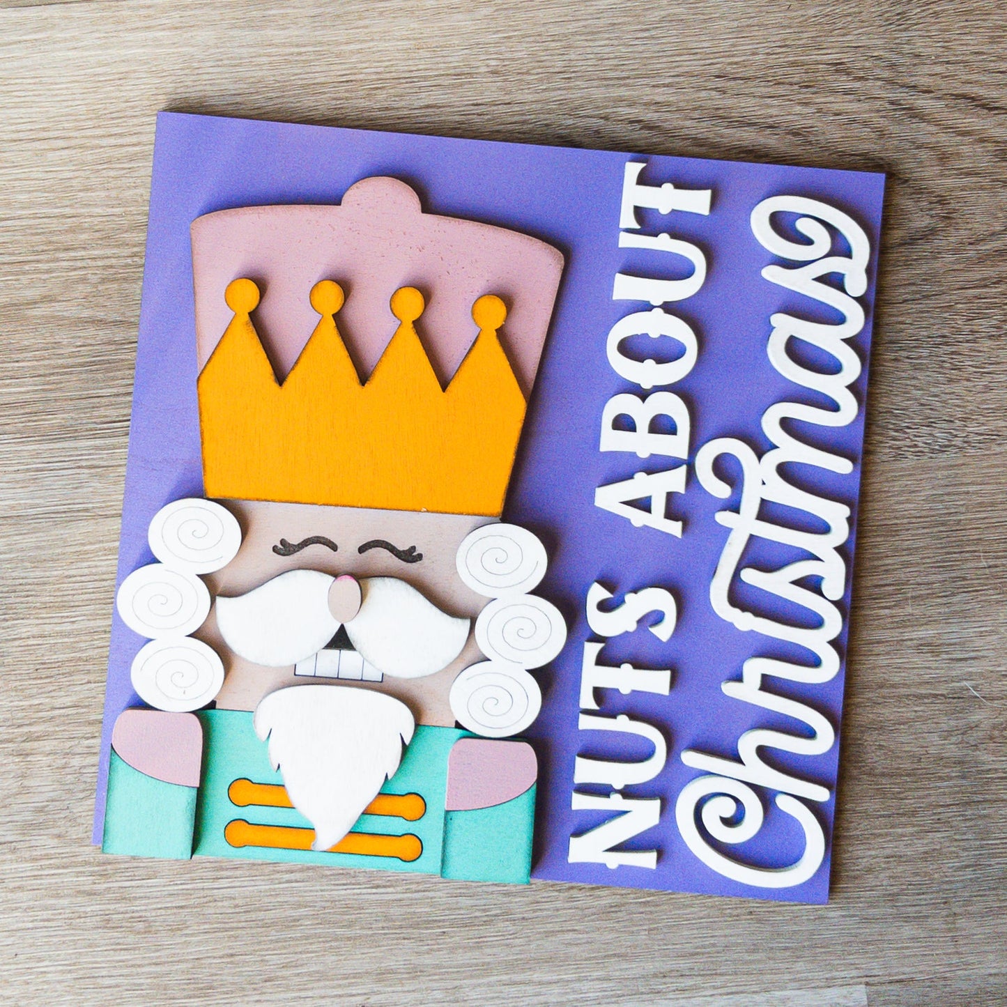 hand-painted interchangeable Christmas tile featuring a classic nutcracker soldier - Millie & Co.