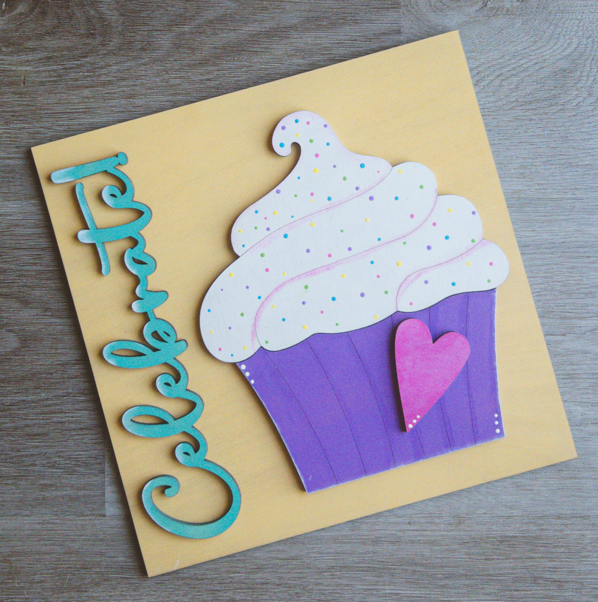 Interchangeable birthday porch decor tile with Celebrate script and a purple cupcake | Millie & Co.