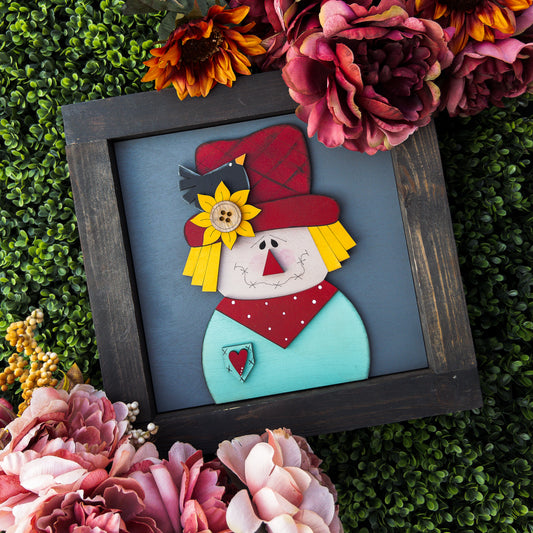 Fall porch decor tile with a stitched-face scarecrow, sunflower hat, and blackbird | Millie & Co.