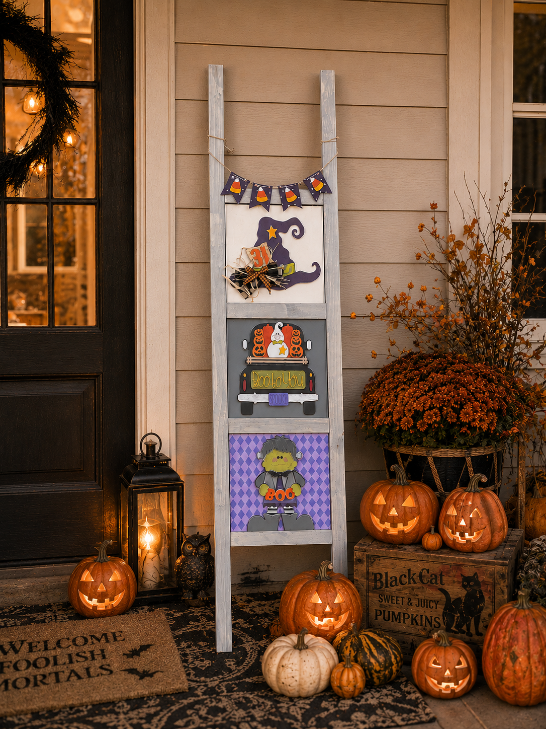 Halloween Porch Decor Ladder Look: grey 5-foot interchangeable porch ladder with Witch's Hat, Boo To You Truck, and Frankie tiles and a candy corn ladder wrap on a front porch | Millie & Co.