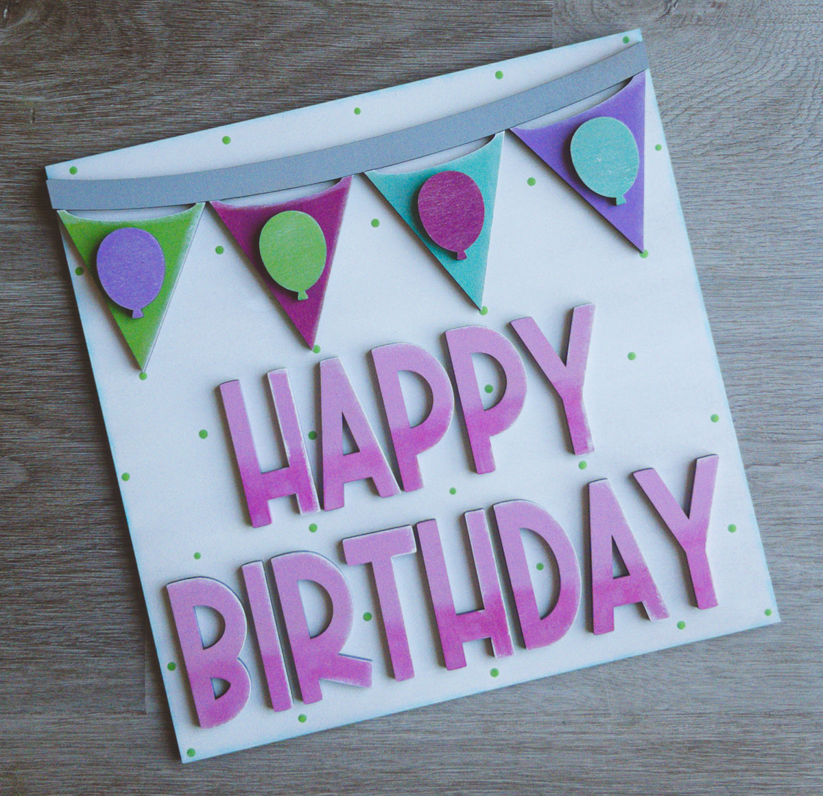 Interchangeable birthday porch decor tile with Happy Birthday lettering and a balloon banner | Millie & Co.