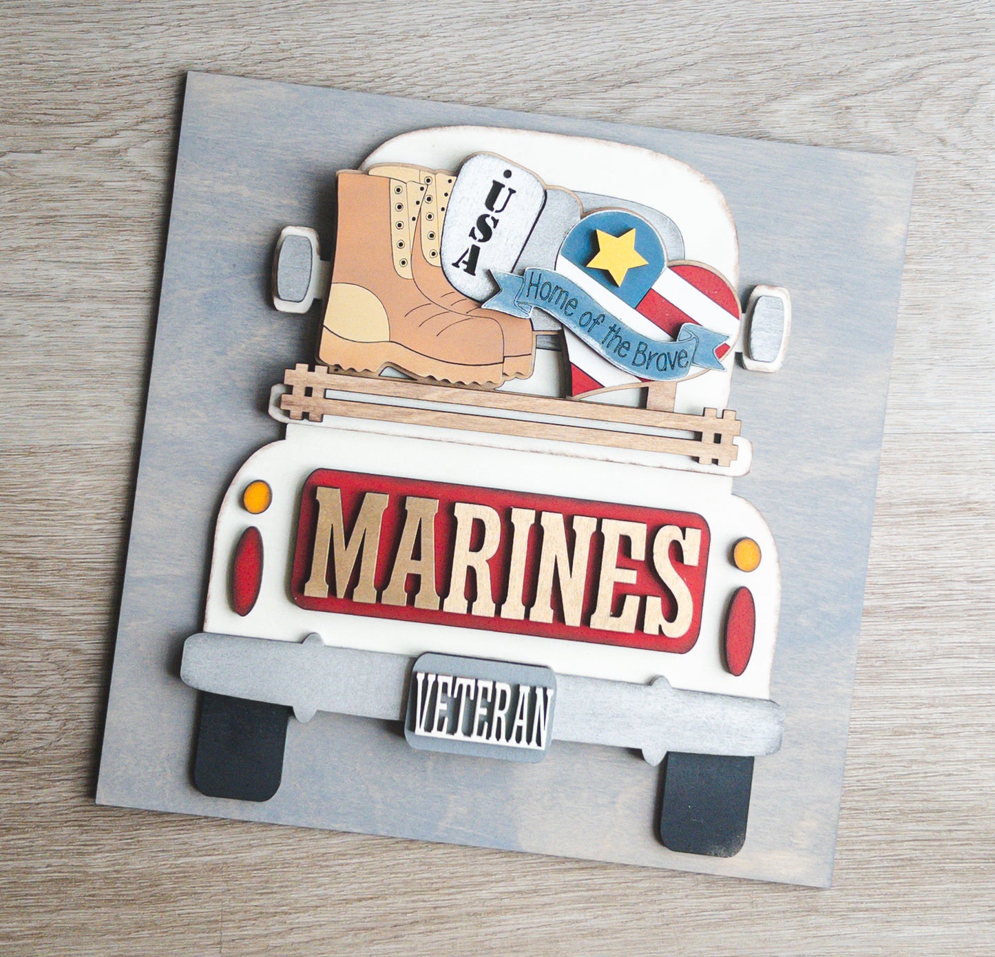 Patriotic porch decor tile of a Marines military truck in bold red and gold — Millie & Co.