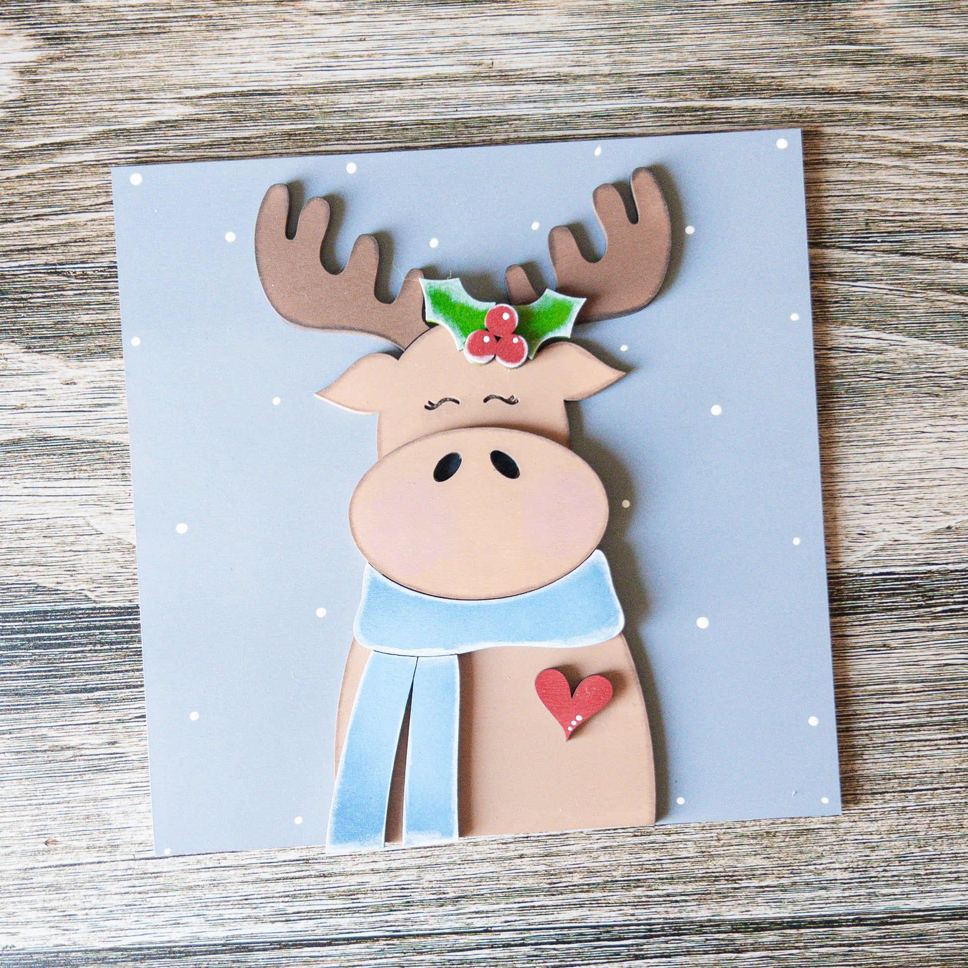 hand-painted interchangeable winter tile featuring a moose with a scarf - Millie & Co.