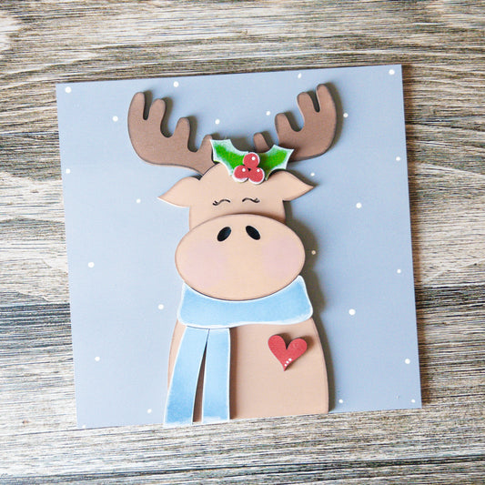 hand-painted interchangeable winter tile featuring a moose with a scarf - Millie & Co.