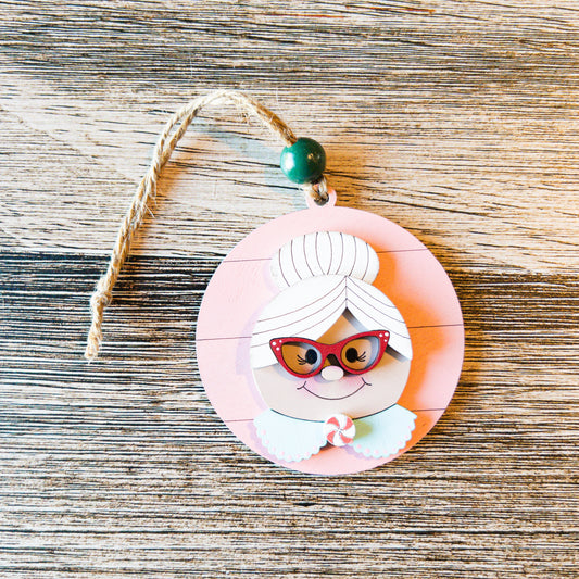 hand-painted Mrs. Claus ornament with peppermint and glasses detail - Millie & Co.