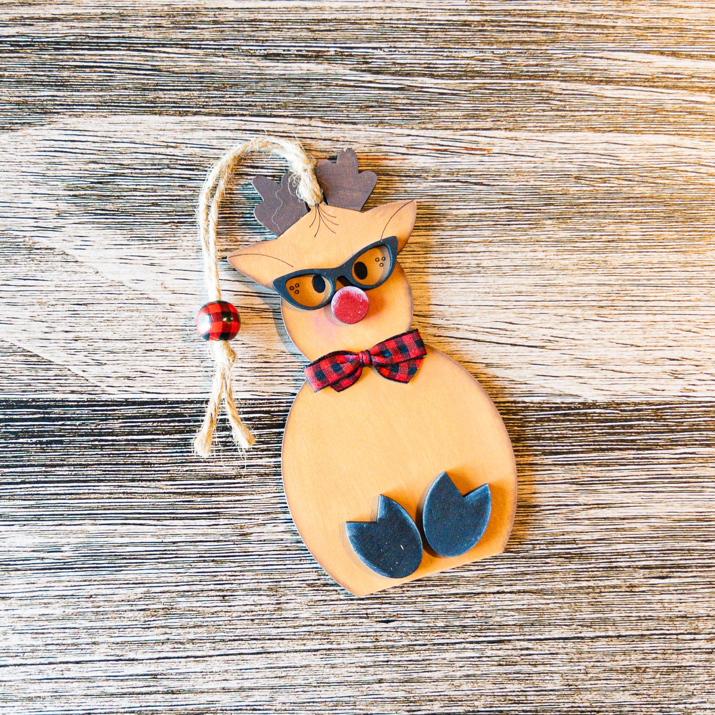 hand-painted reindeer ornament with sunglasses and buffalo check bowtie - Millie & Co.