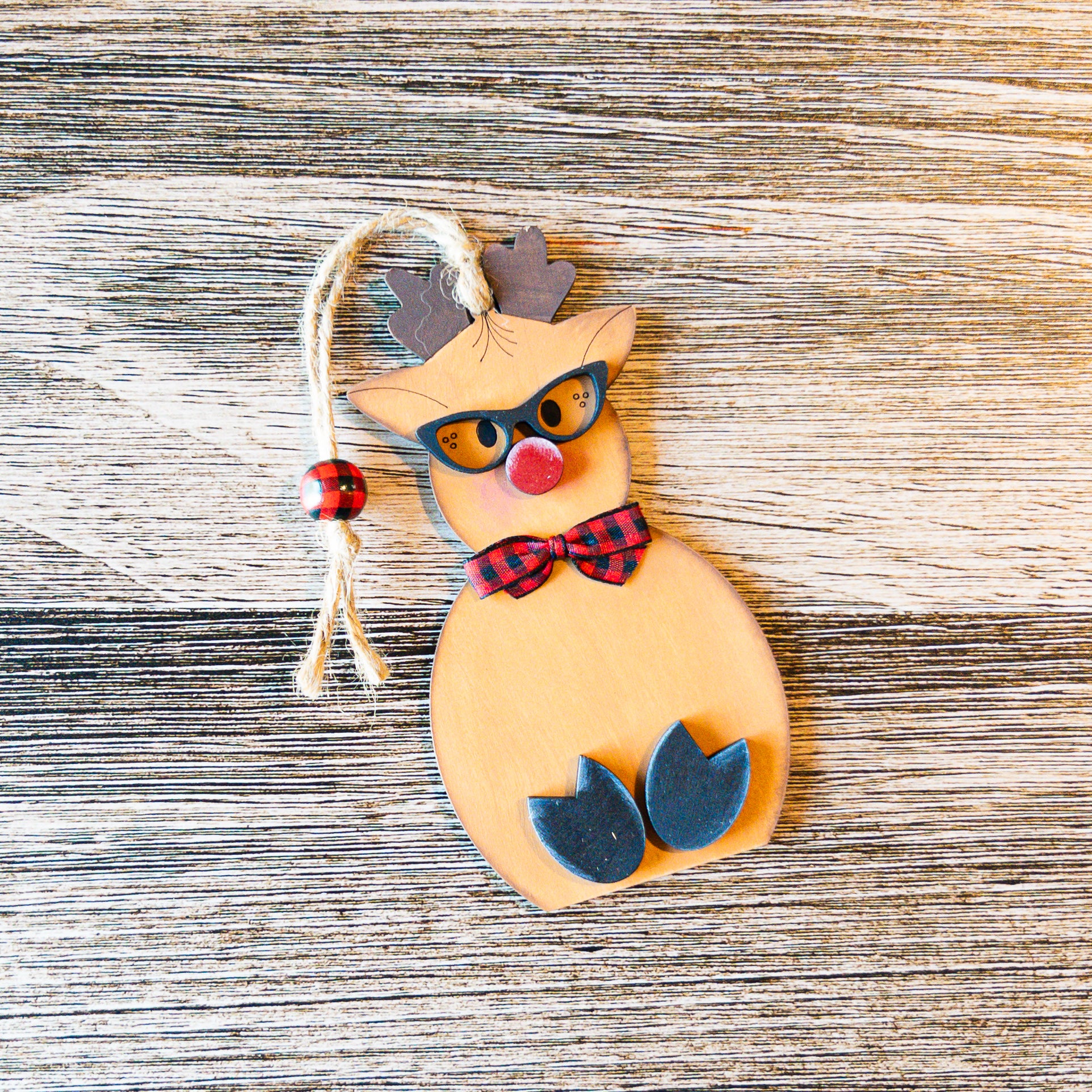 hand-painted reindeer ornament with sunglasses and buffalo check bowtie - Millie & Co.