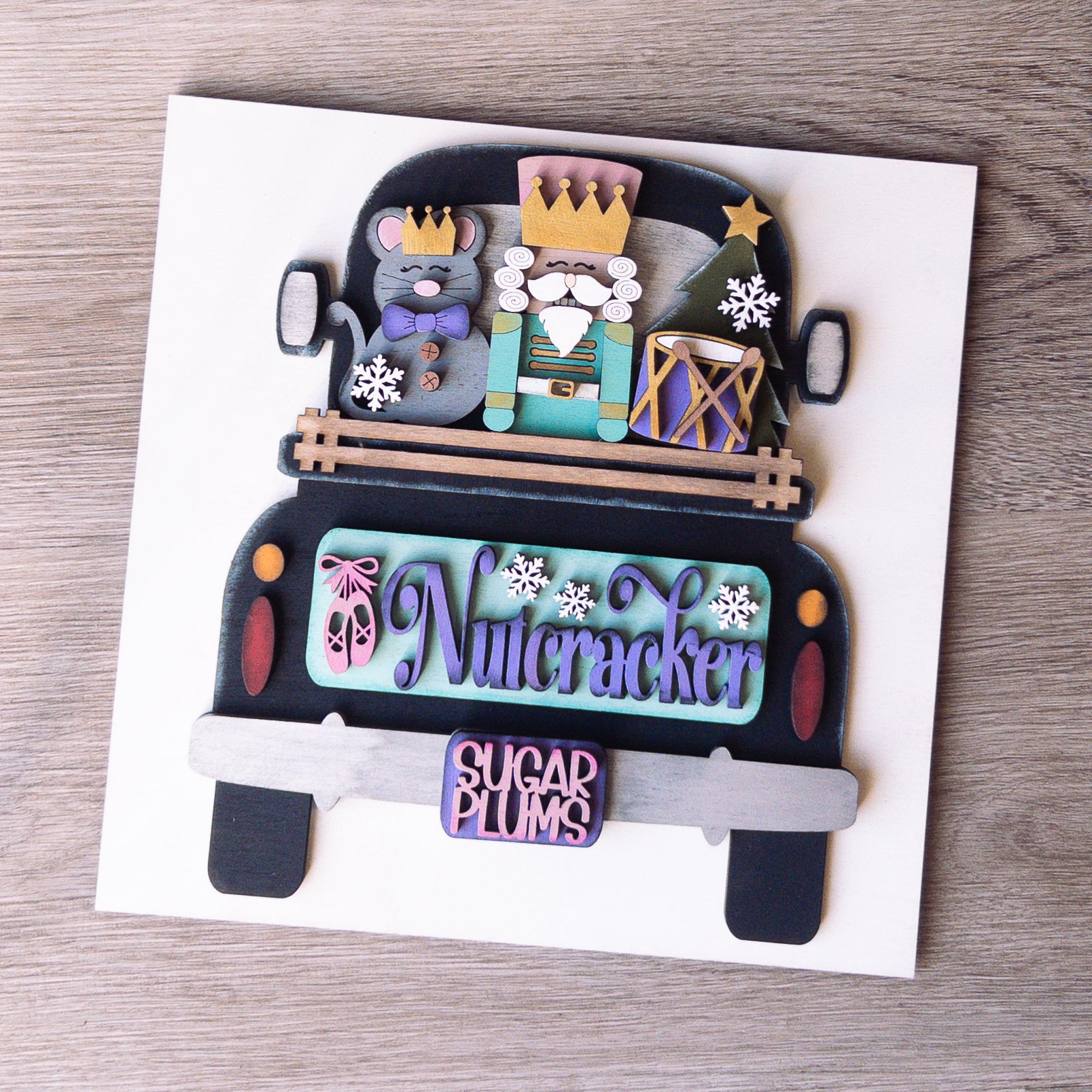 hand-painted interchangeable Christmas tile featuring a nutcracker truck with mouse and drum - Millie & Co.