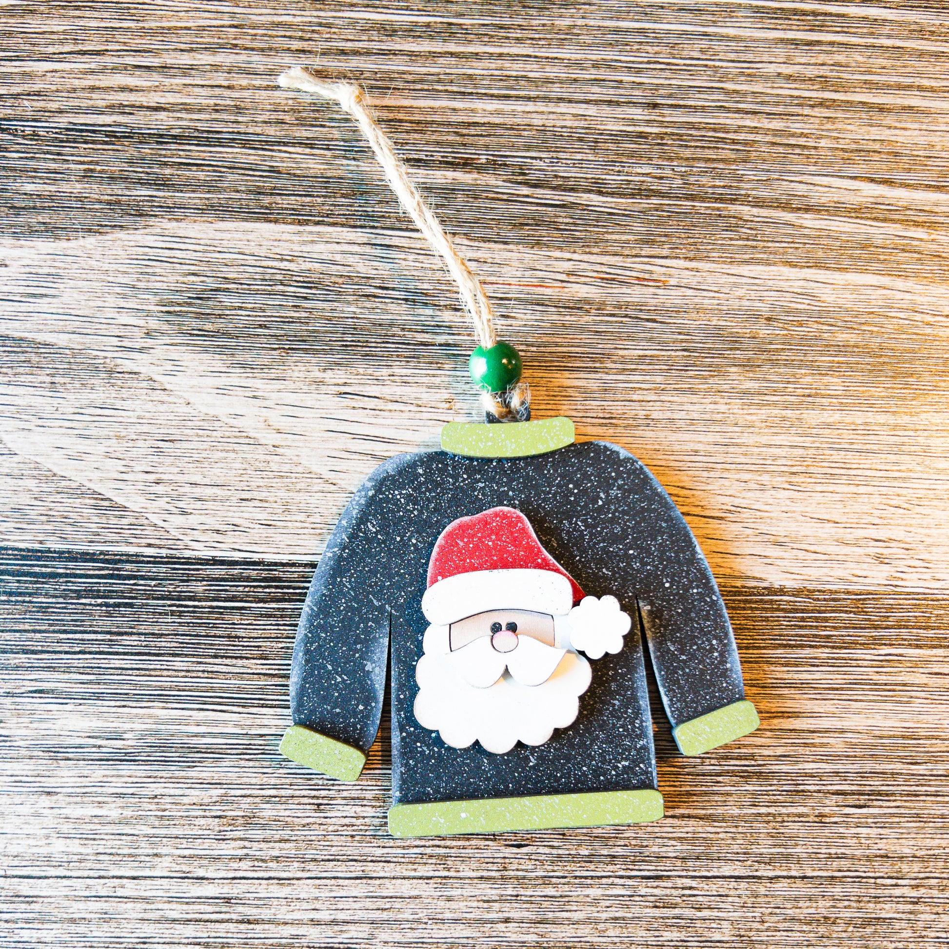 hand-painted black and green Santa sweater ornament - Millie & Co.