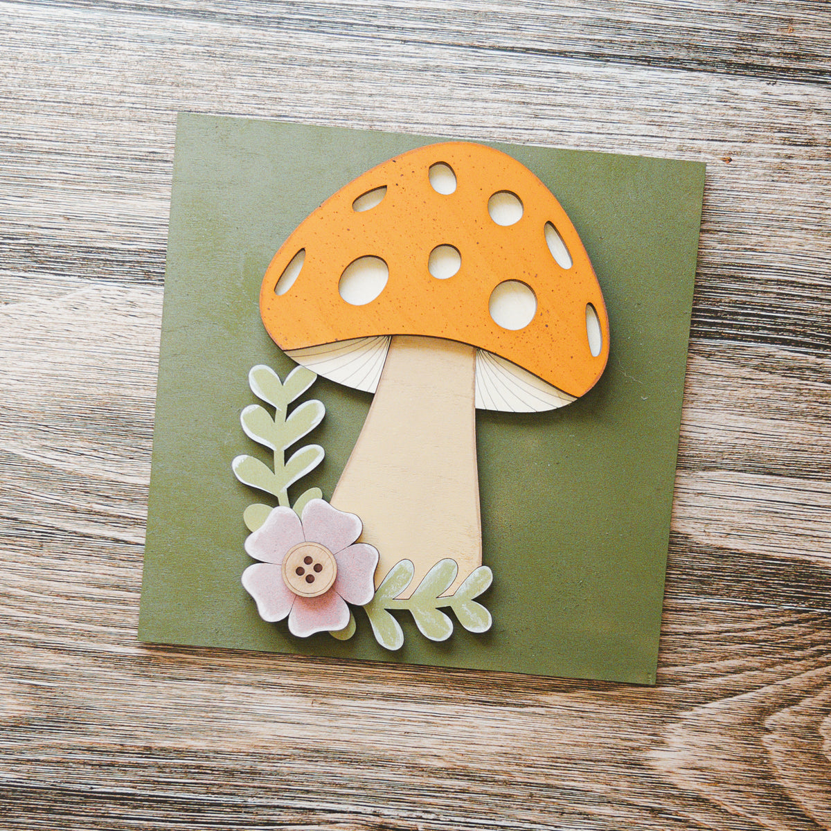 Spring porch decor tile with an orange mushroom and pink flower on moss green wood, Millie & Co.