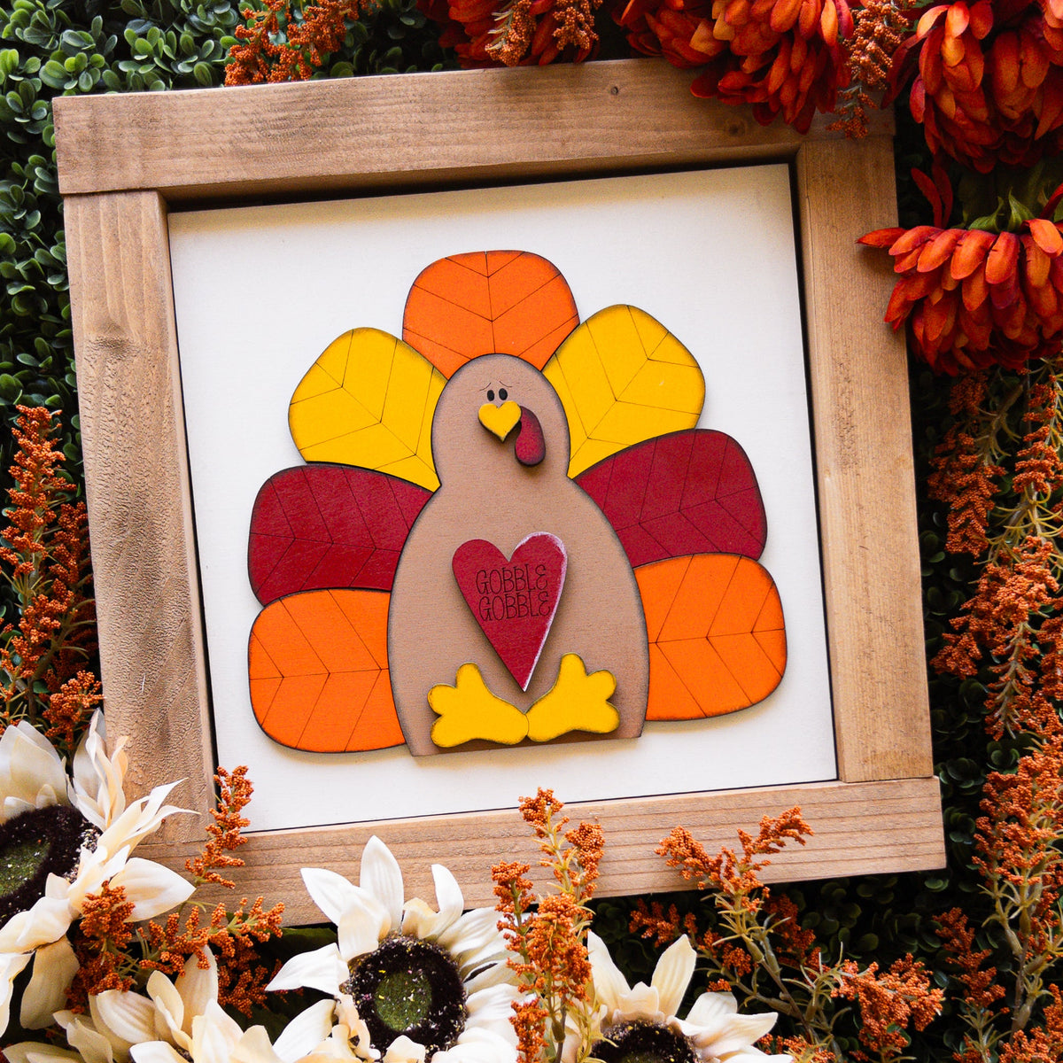 Turkey Thanksgiving porch decor tile of a turkey holding a heart with layered fall feathers, included in the Thanksgiving Porch Decor Ladder Look | Millie & Co.