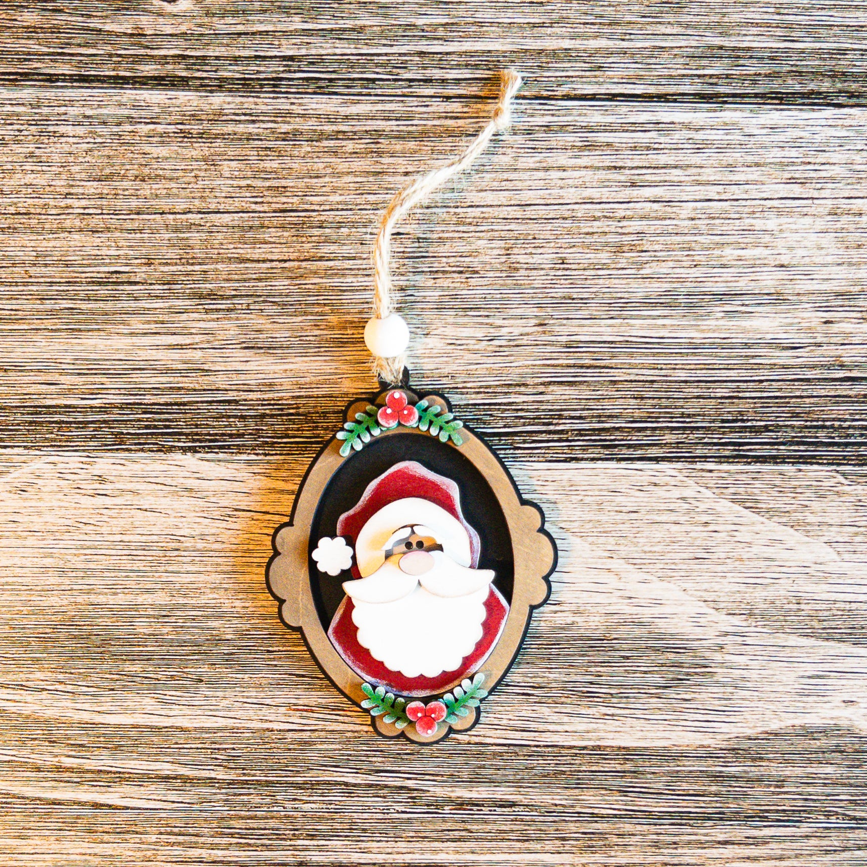 hand-painted vintage cameo Santa ornament with evergreen accents - Millie & Co.