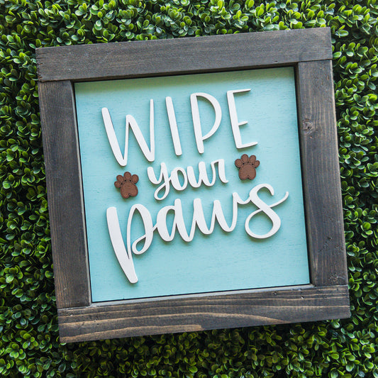 Interchangeable porch decor tile with Wipe Your Paws script and paw prints on aqua | Millie & Co.